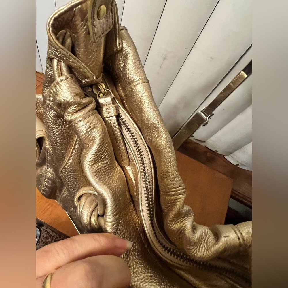 Michael Kors Metallic Gold Leather Drawstring Shoulder Bag. - Picture 16 of 16